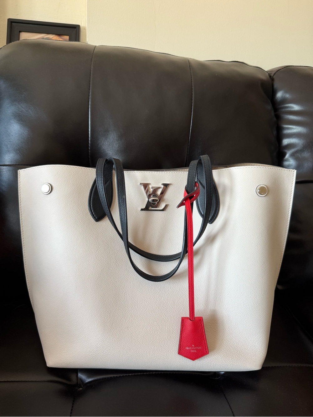 Louis Vuitton lock me Cream Tote with Black Handles and Red Tag